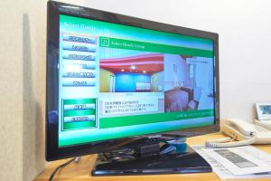 TV a/nebo společenská místnost v ubytování Hotel Select Inn Sano-Ekimae