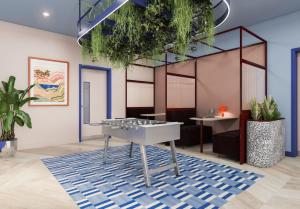 a room with a table with plants on the ceiling at For Students Only - Central Studios in Reading in Reading