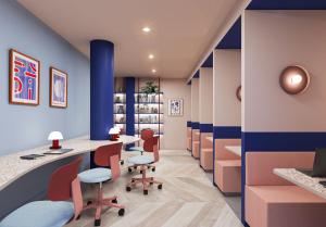 an office with blue and white walls and desks and chairs at For Students Only - Central Studios in Reading in Reading