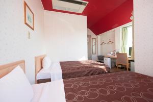 Postel nebo postele na pokoji v ubytování Hotel Select Inn Sano-Ekimae