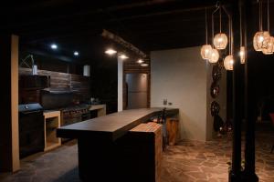 a kitchen with a large island in the middle at Casa Sacre in Cuatunalco