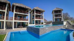 an image of a villa with a swimming pool at Casa Sacre in Cuatunalco
