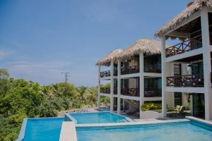 a view of a resort with two pools at Casa Sacre in Cuatunalco