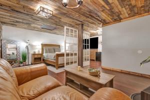 a living room with a bed and a couch at Peaceful Studio & Work Friendly Walk to Hyde Park in Tampa