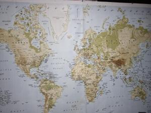 a large map of the world on a wall at El Cacique in Alajuela