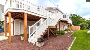 a house with a white staircase on it at Sunset Shore House Second Floor in West Cape May