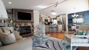 a living room with a couch and a fireplace at Sunset Shore House Second Floor in West Cape May