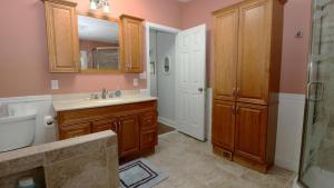 a bathroom with a sink and a shower at Sunset Shore House Second Floor in West Cape May +21 photos