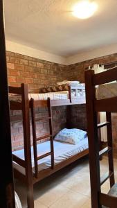 a group of bunk beds in a room at Casa no centro de Serra Negra in Bezerros +2 photos