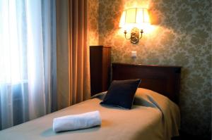 Posteľ alebo postele v izbe v ubytovaní Hotel Plock + 37 fotografií