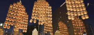 a tall building with a lot of lights on it at ホテルデジャブ大人専用 in Akita