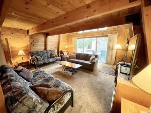 a living room with a couch and a table at Pine Knot Guest Ranch in Big Bear Lake