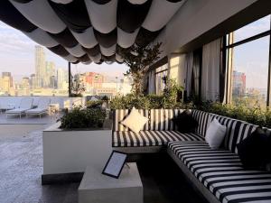 a couch sitting on the side of a building at Hotel Stella Maris in Mexico City