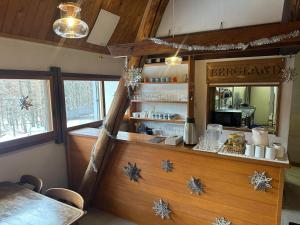 a restaurant with a counter with snowmen on it at Yamadasan Ski Lodge - Madarao in Madarao Kogen +23 photos