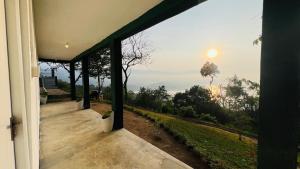 a view from the porch of a house at The victoria hill Cottage in Digana