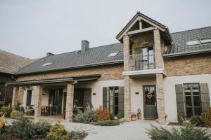 a brick house with a black roof at Villa Antiqua in Racibórz