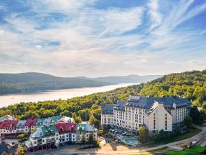 an aerial view of a town with a river at Fairmont Tremblant in Mont-Tremblant