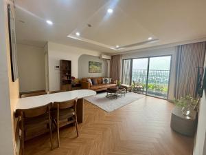 a living room with a large table and a couch at 2BR Minato Apartment, Free Swimming Pool & Gym in Hai Phong