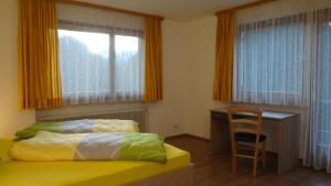 Posteľ alebo postele v izbe v ubytovaní Ferienhaus Willi