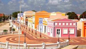 a row of colorful buildings on a city street at Pousada Nova Betânia in Mossoró