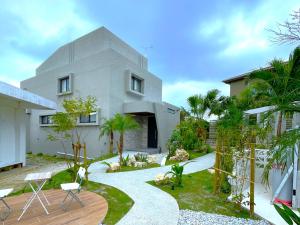 a house with a garden in front of it at Mihana Onnason in Onna