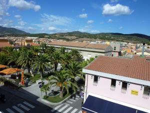 a view of a city with palm trees and buildings at Domus Incani in Villasimius