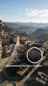 a view of a city with a sign that reads apartments turtles coalition at Apartaments Turistics Cardona I in Cardona
