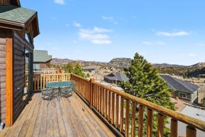 a deck with a table and a table at Teepee Mountain 12A Condo in Estes Park