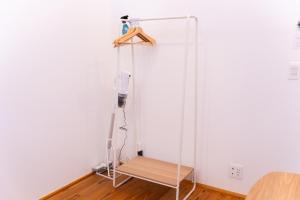 a glass screen in a room with a bench at いなぎの木箱 in Zentsuji +38 photos