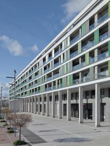a large white building with a lot of windows at Hotel Arrosadía Iriguibel in Pamplona