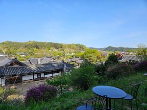 a view of an asian village with buildings and tables at Tohyang Traditional House in Bonghwa +22 photos
