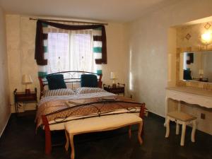 a bedroom with a large bed and a window at Apartments Vysoké Tatry in Vysoke Tatry - Horny Smokovec