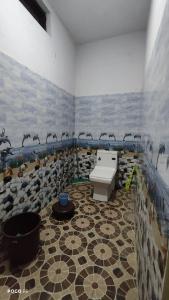 a bathroom with a sink and birds on the wall at The Kedar Heights in Gupta Kāshi