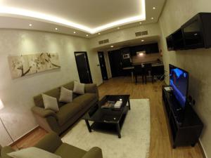 Telewizja i/lub zestaw kina domowego w obiekcie Le Park Hotel