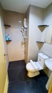 a bathroom with a toilet and a sink at My place 77 2 in Ban Khlong Khwang Klang +8 photos