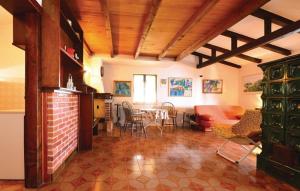 a living room with a kitchen and a dining room at House by the sea in Mali Iž +21 photos