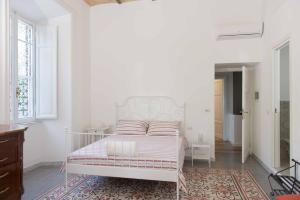 Postel nebo postele na pokoji v ubytování B&B Domus Aurea