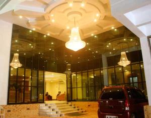 a building with a car parked in front of it at Hotel Sun World in Kanyakumari +12 photos
