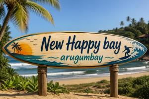 a new happy bay anniversary sign on the beach at New Happy bay in Arugam Bay