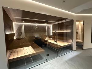 a room with a shower with glass walls at Hotel Seeblick in Bernried