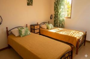a room with two beds and a window at La Nuit Étoilée , Restez plus, payez moins ! in La Gaulette
