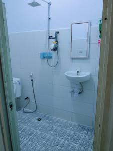 a bathroom with a shower and a sink at Sulis homestay in Kuta Lombok +30 photos