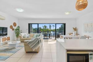 a living room with a couch and a table at The Lake House in Mulwala