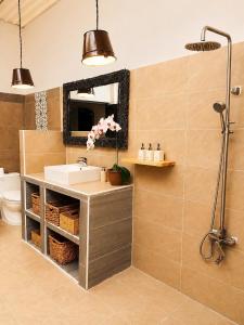 a bathroom with a sink and a mirror at Art Hill Villas in Kao Kuil +18 photos