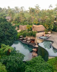 an aerial view of a resort with a swimming pool at Aksari Resort & Spa Ubud by Ini Vie Hospitality in Ubud