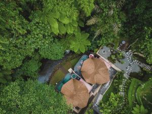 an overhead view of a park with two umbrellas at Aksari Resort & Spa Ubud by Ini Vie Hospitality in Ubud +54 photos