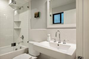 a white bathroom with a sink and a toilet at The Arrowhead Pearl in Lake Arrowhead +33 photos