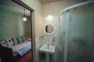 a bathroom with a sink and a shower and a mirror at Agriturismo La Marletta in Imola +47 photos