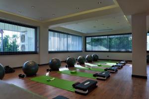 a row of yoga mats in a room with large windows at De Suite Hotel in Antalya