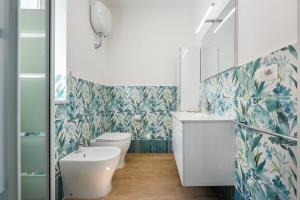 a bathroom with a toilet and a sink at La casa del Pescatore in Procida +37 photos